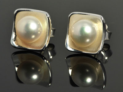 Beautiful white cultured pearl, cupped in a handmade bed of pure silver