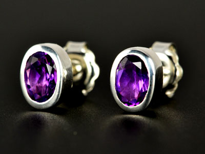 Stunning, handmade gem quality amethyst oval studs set in pure silver.