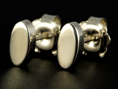 Handmade, chunky oval studs in sterling silver with a polished finish