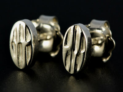 Handmade, chunky oval studs in sterling silver with a barked effect finish