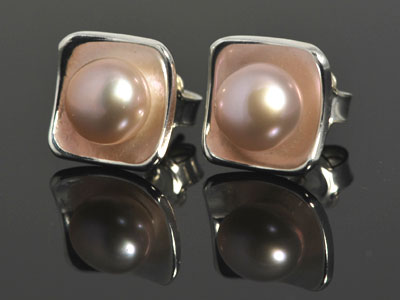 Pink cultured pearl, cupped in a handmade bed of pure silver