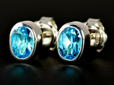 Stunning, handmade gem quality Swiss blue topaz oval studs set in pure silver.